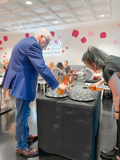 wine sommelier pouring Rosé wine at event in Fishers, Indiana 