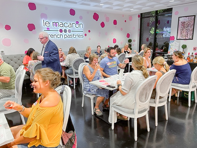 image of people enjoying wine at le macaron fishers in fishers, indiana