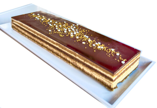 A classic French dessert! Layers of almond joconde sponge cake layered with decadent buttercream & chocolate ganache. (Approximately 14” x 3 3/4”)