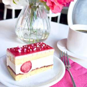 Delicate yellow cake layered with strawberry compote, silky vanilla mousse, and whole strawberries. 