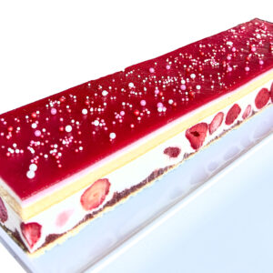 Delicate yellow cake layered with strawberry compote, silky vanilla mousse, and whole strawberries.