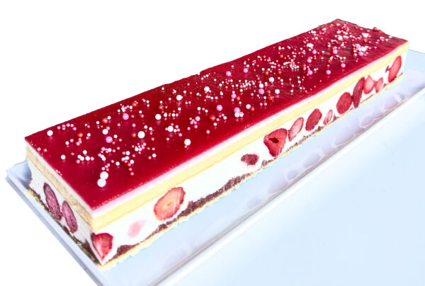 Delicate yellow cake layered with strawberry compote, silky vanilla mousse, and whole strawberries.